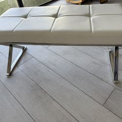 Modern White Tufted Bench with Chrome Legs.