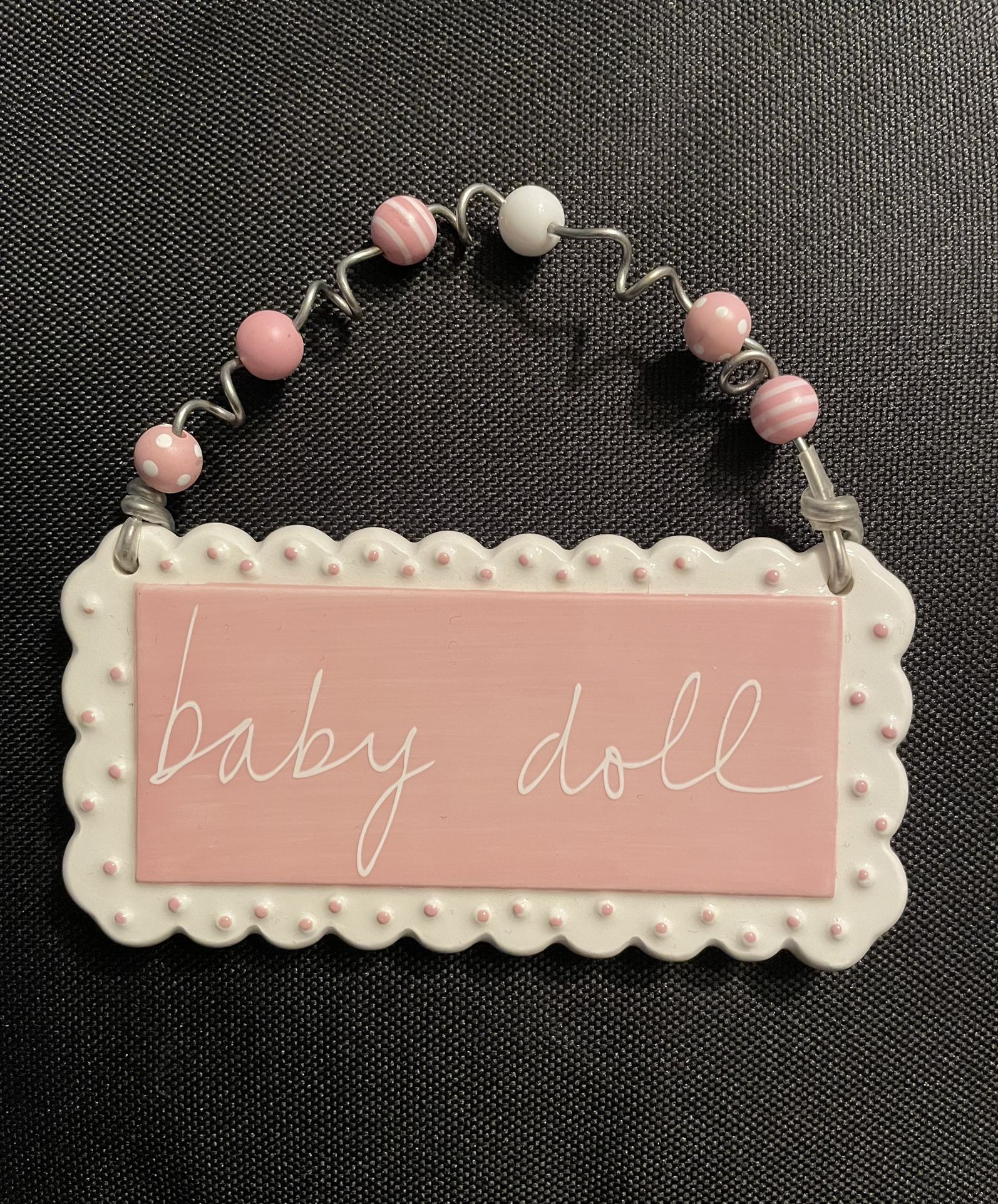 Sandra Magsamen Collectible Tiles. Background Is Pink Writing Is White, Beautiful Beads Adorn.
