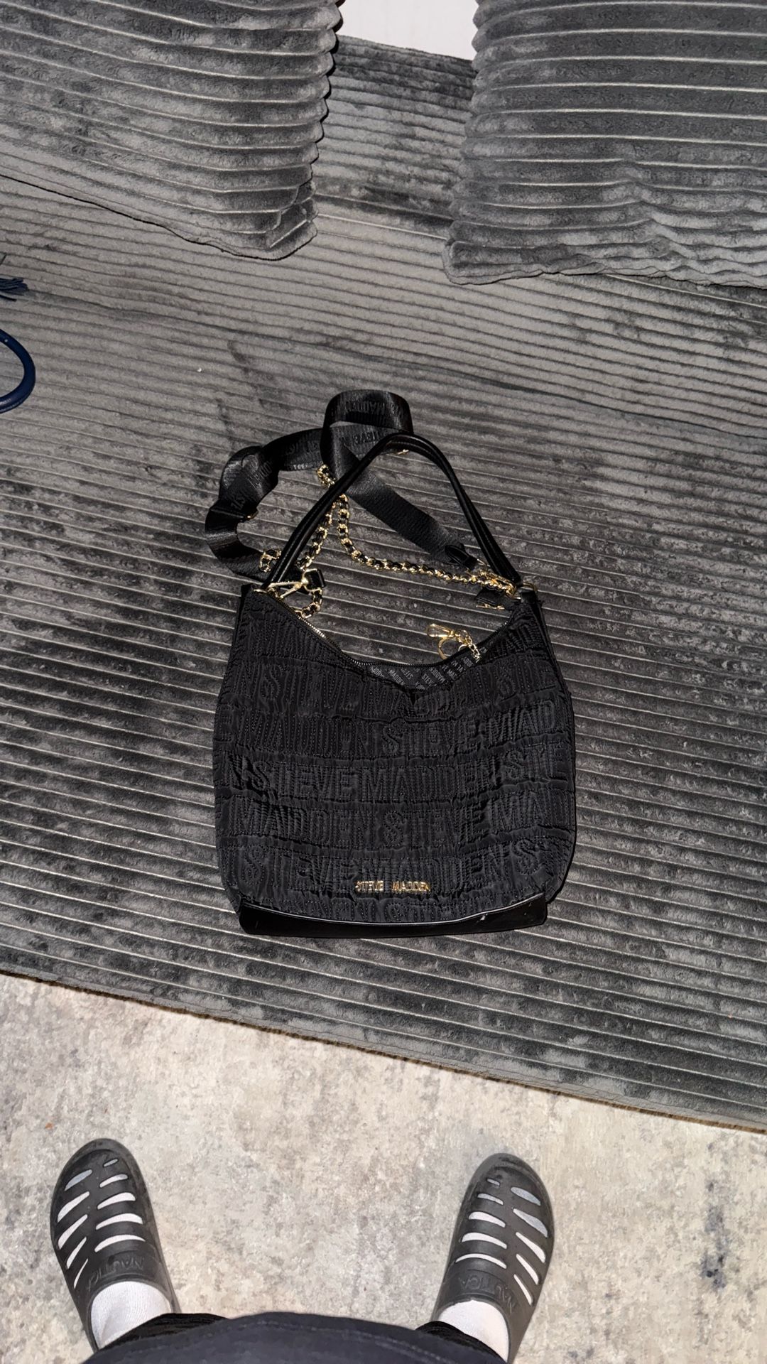 This is a Steve Madden Black Quilted Nylon Shoulder Bag with Dual Straps