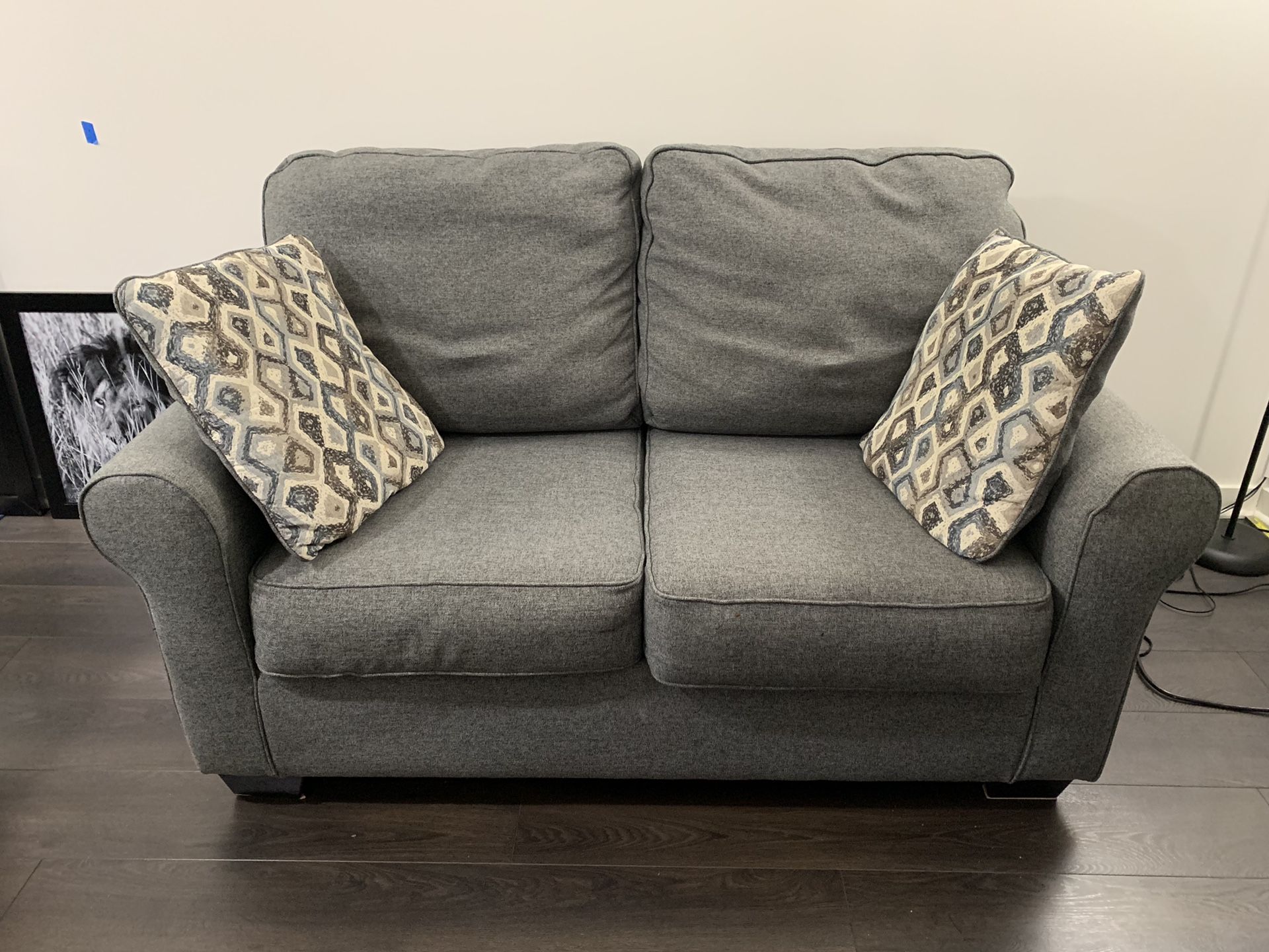 Ashley Loveseat with Pillows and OPTIONAL Storage Ottoman (extra charge)