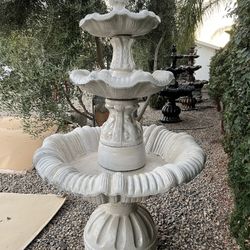 Water Fountains And Concrete Tables