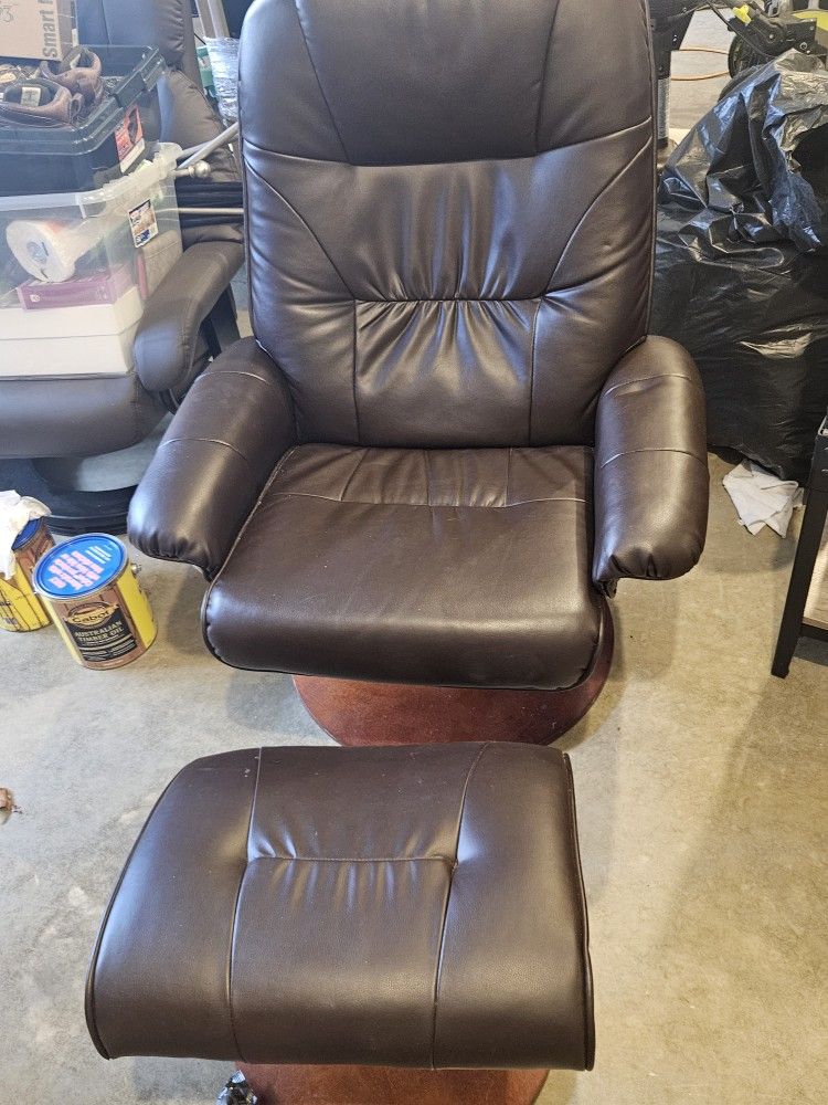 Brown Leather Swivel Chair And Ottaman