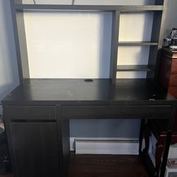 black desk with whiteboard