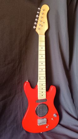 Small guitar built in speaker