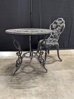 Round Black Cast Iron End Table with Floral Pattern