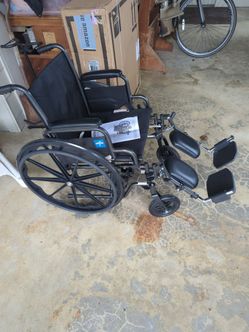 Brand new unopened Medline Wheelchair with Elevating Leg Rests