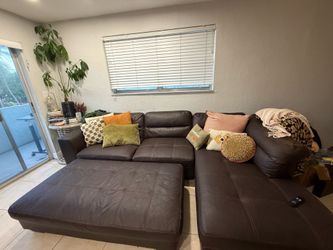 Free couch and dusty pink tv stand