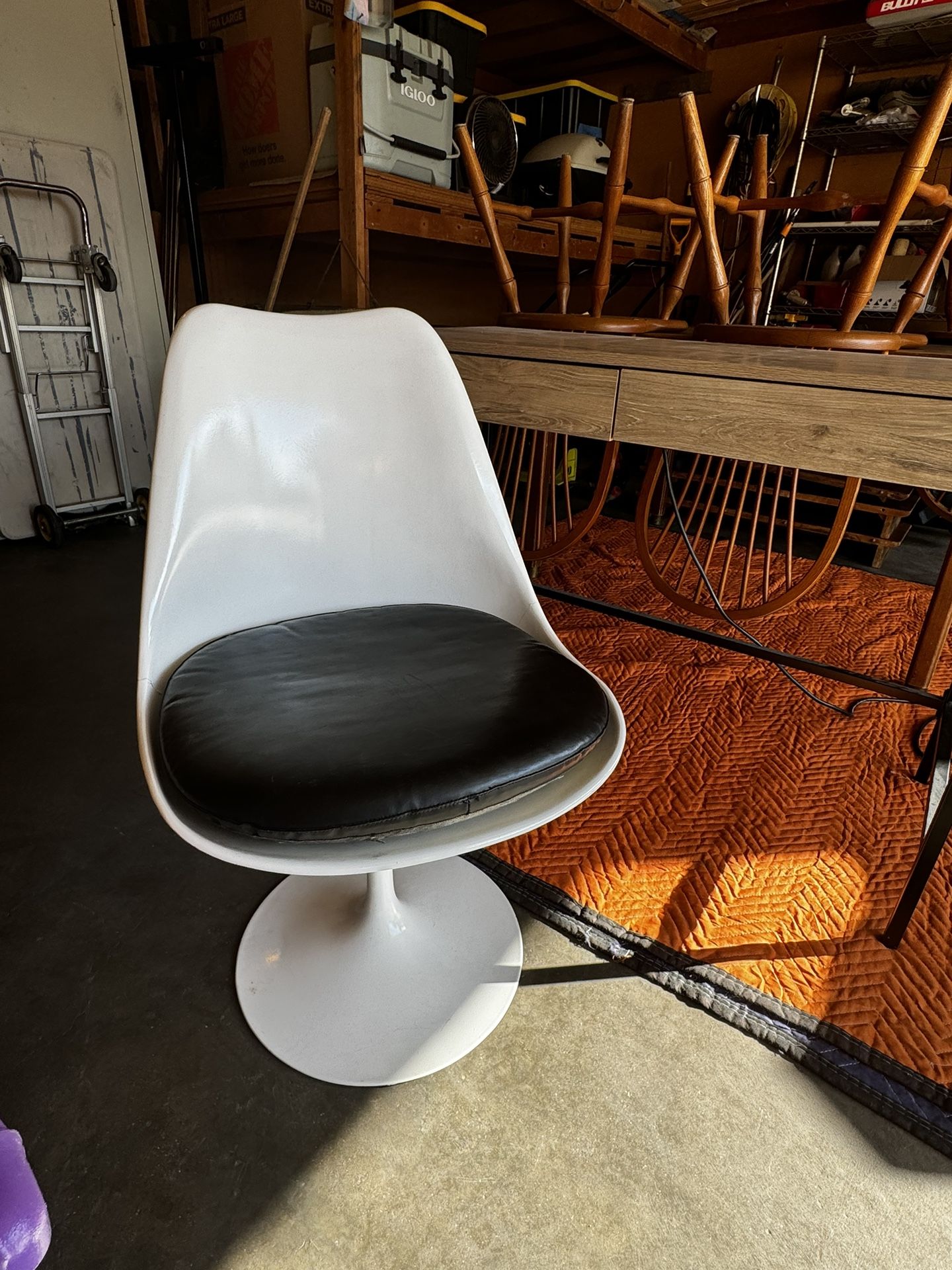 White tulip chair with leather seating pad