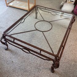 Glass coffee table with metal frame