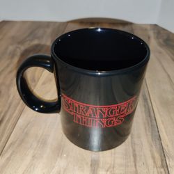 Netflix Stranger Things Black 20oz Mug 'Friends Don't Lie'. Has some wear from age and storage. Sold as is.

