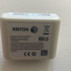 This is a Xerox Wireless Network Adapter, model number 497K16750. 