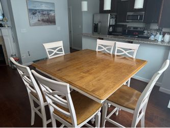 Solid wood dining table with leaf built-in and 6 chairs