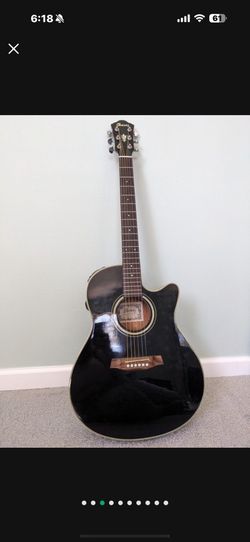 Black Ibanez electric acoustic guitar with a hard case with Picks , Tuner, Etc