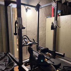 Workout rack with bench and exercise bike