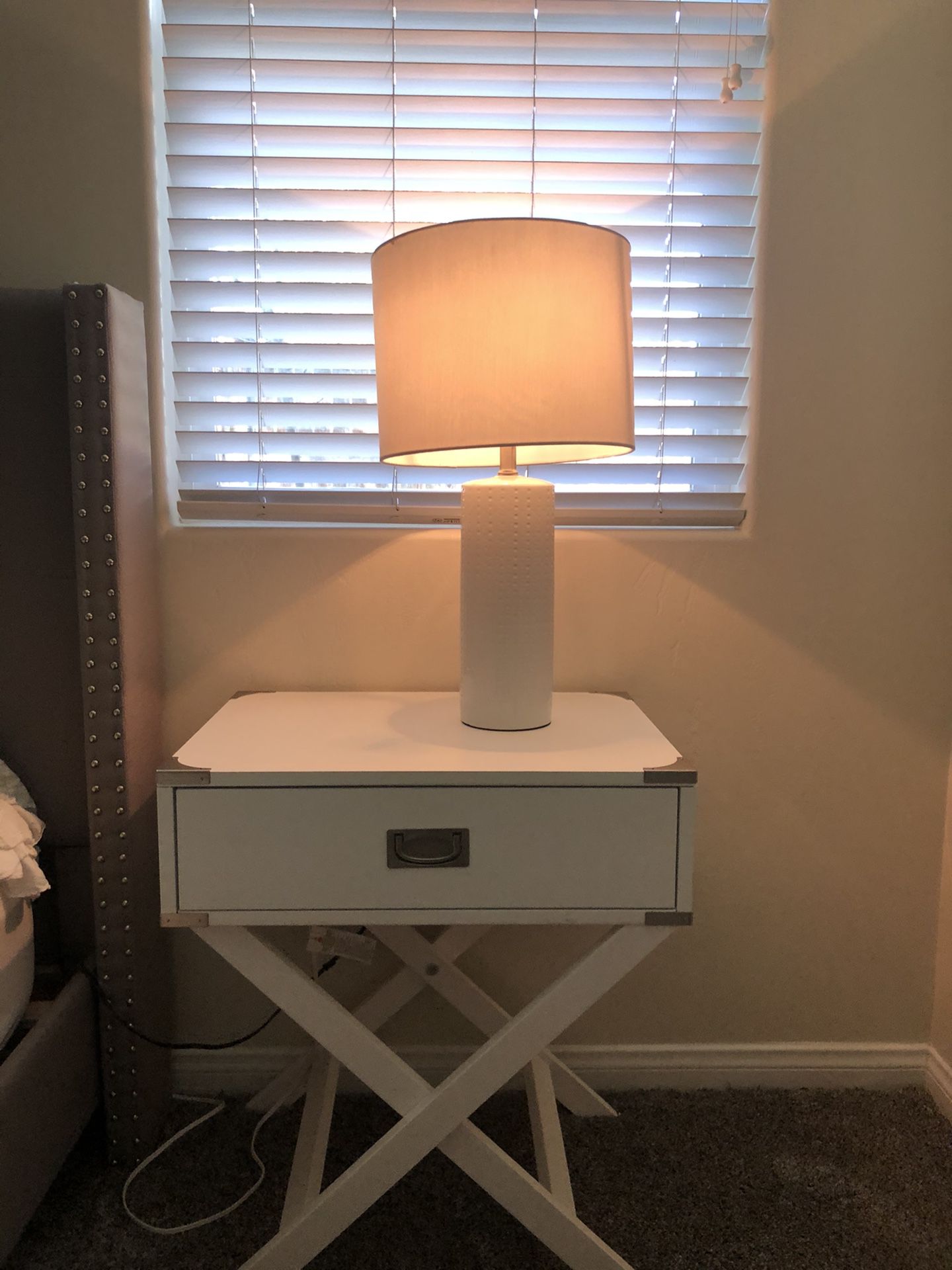White lamp with lamp shade.