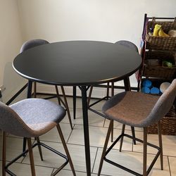 Black high top table & four grey bar stools