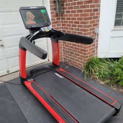 Premium Life Fitness Elevation Treadmill with Discover SE3 HD console. Custom Red Color Frame.
