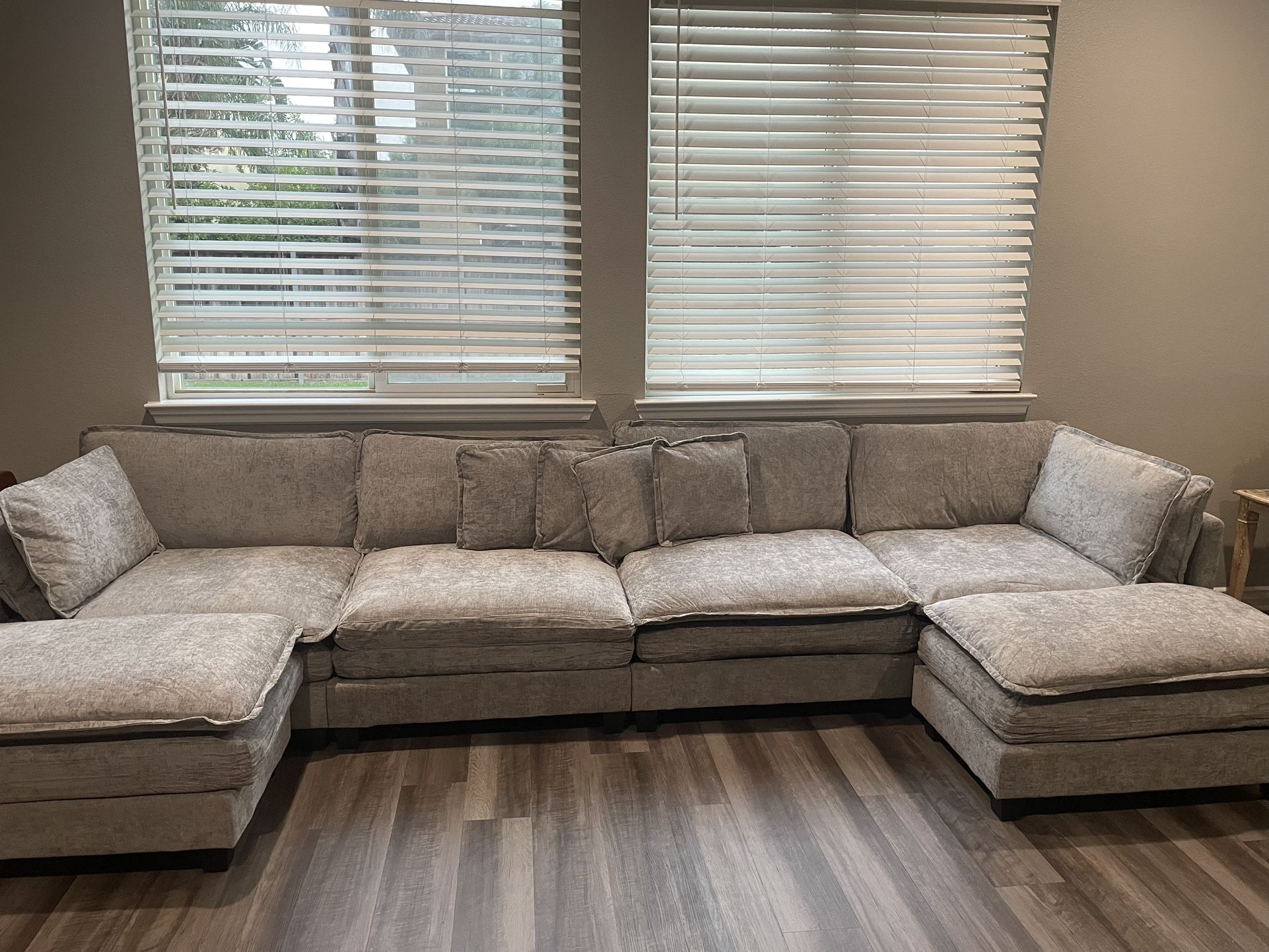 Beautiful gray large couch with two Ottomans 12 foot long brand new never use