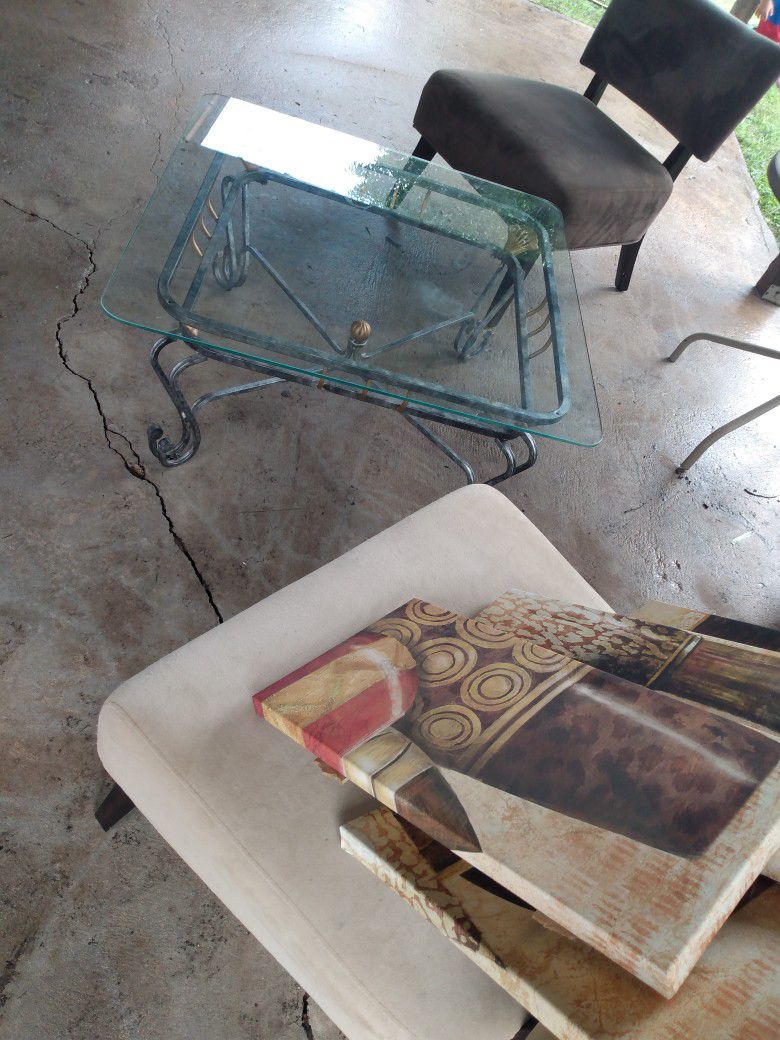 Chairs And Coffee Table With Paintings