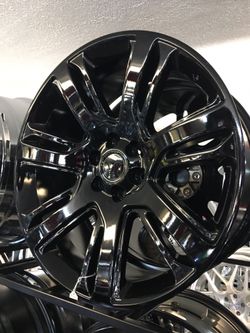 24" gloss black replicas in stock now!! Wheel/tire package!! Se habla español