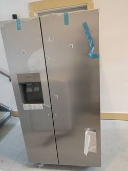 stainless steel Frigidaire side-by-side refrigerator,