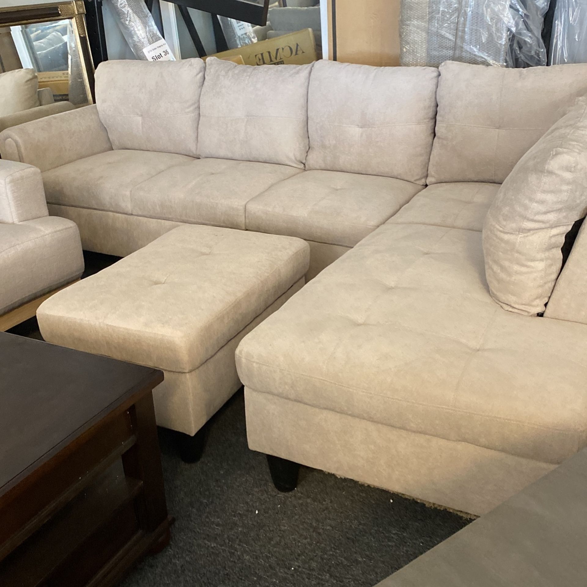 New Sectional 3 Piece Must Sell All Colors & This Grey Floor Model. Dark & Light & Black Pleather Still Available. Can Deliver Ottoman Included!