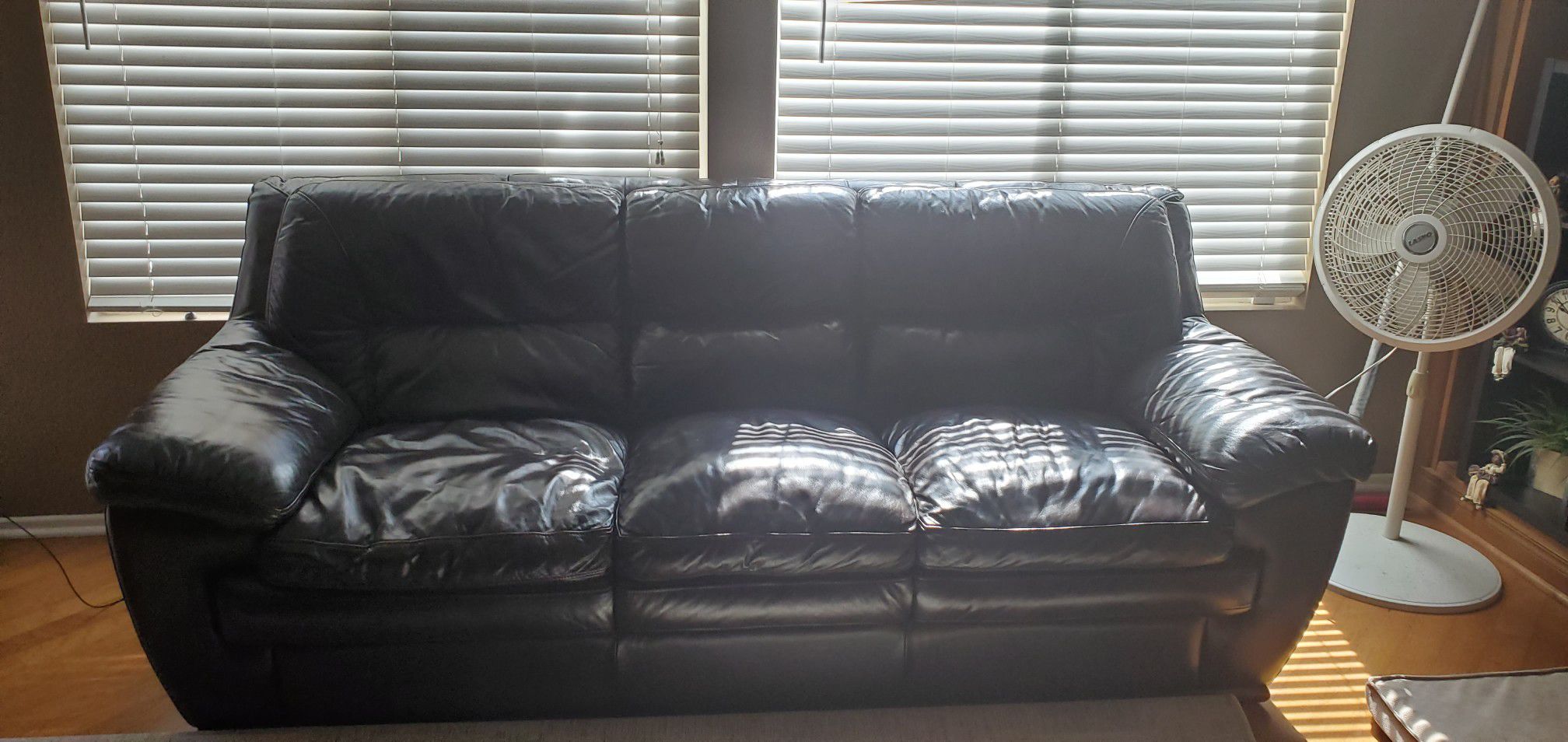 Brown leather sofa and chair