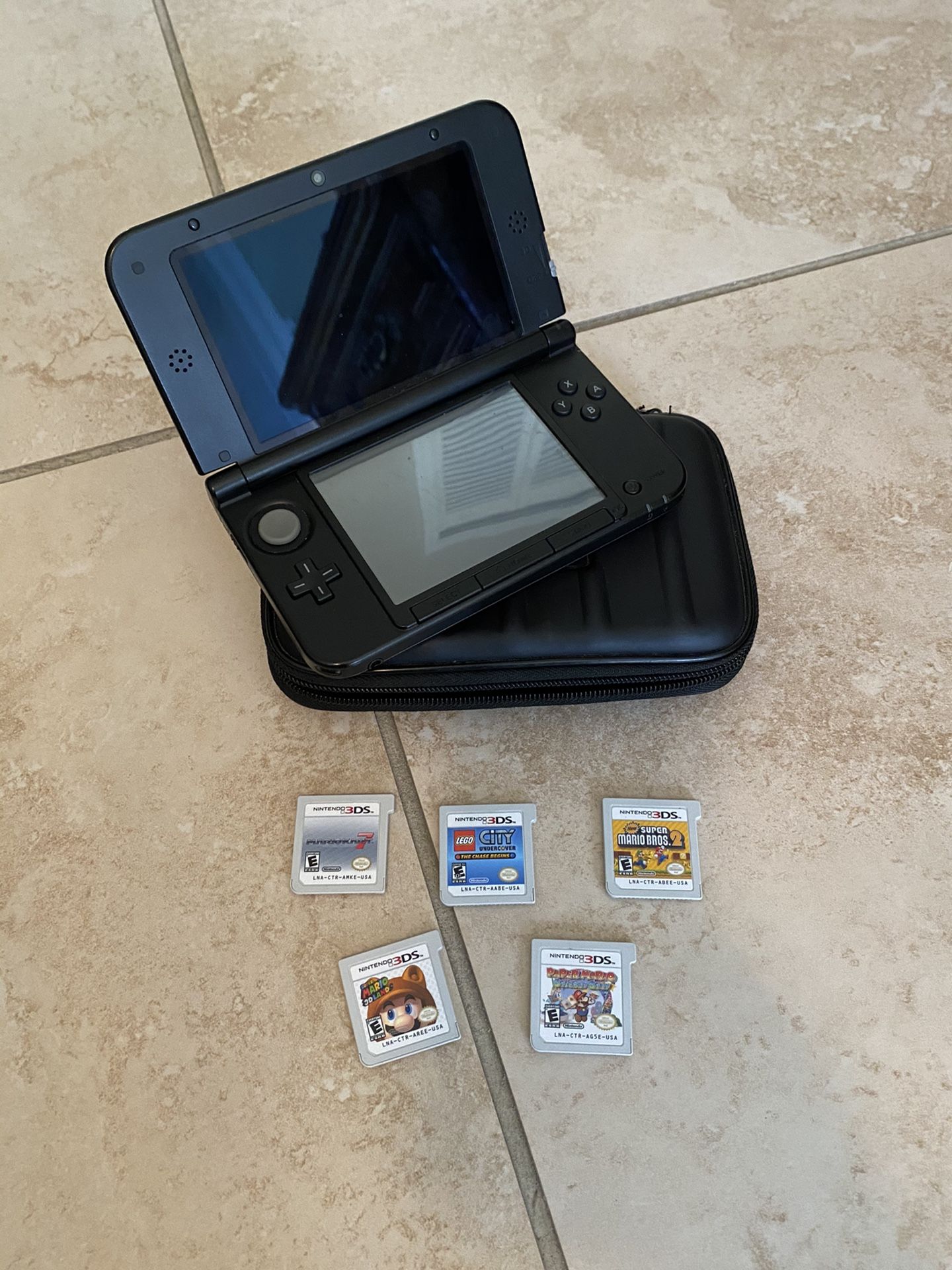 Nintendo 3DS XL with case, charger and 5 3D games
