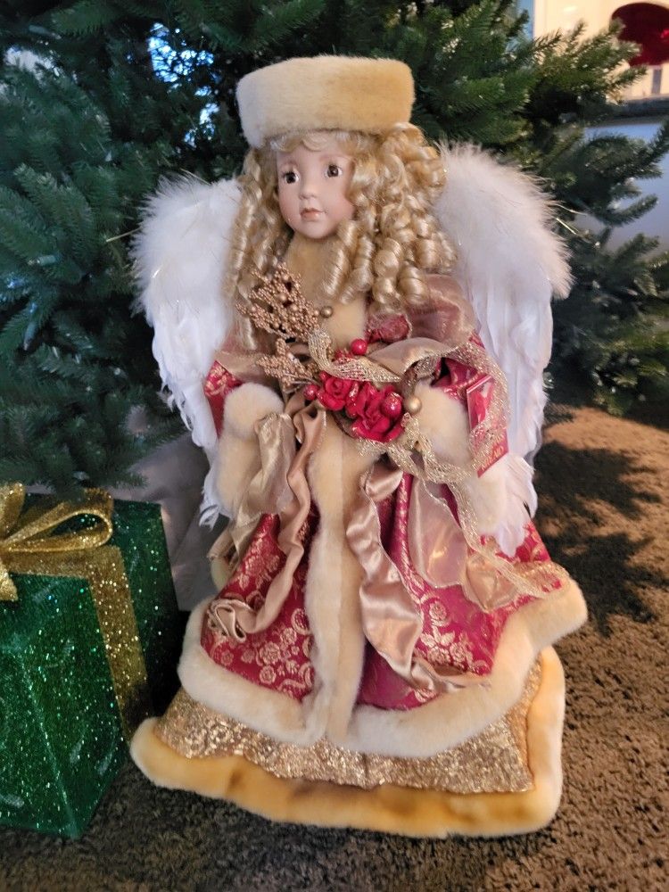 Large porcelain angel doll can be used for a tree topper , perfect , eighty dollars