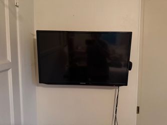 32” TV with Roku device attached