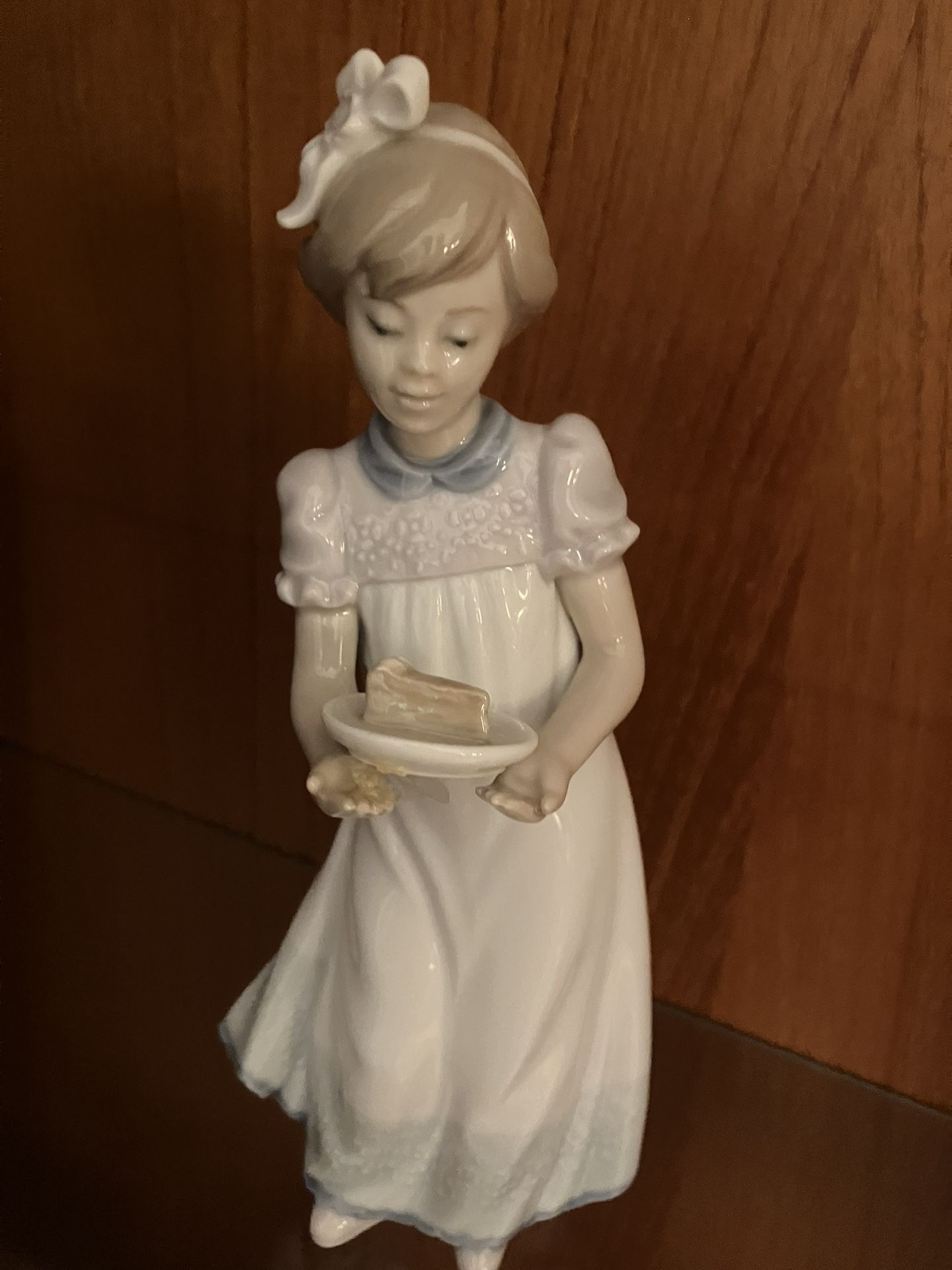 Lladro-girl holding piece of cake, cute!