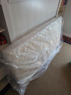 Twin Mattress with 2" Memory Topper in like new condition.