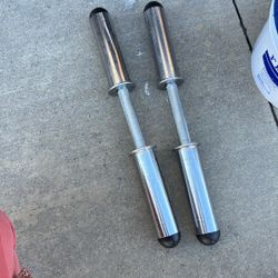 Olympic-style dumbbell handles.