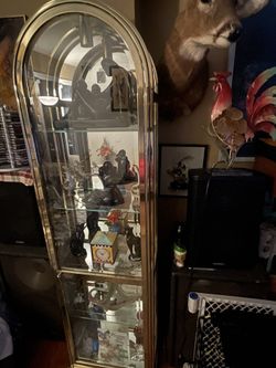 Vintage , Elegant Glass Brass display case is a showstopper in any interior 