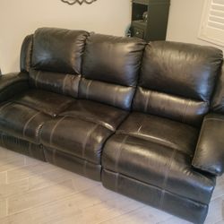 Jeromes Faux Leather Motorized Reclining Couch