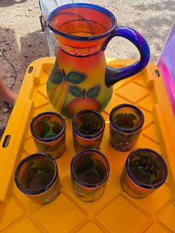 Glass pitcher with cups