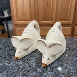Vintage  Pottery Mouse Pair of Salt and Pepper Shakers.  The Tail is the Handle.  Size approximately 5 inches long.  Preowned missing 1 stopper.  