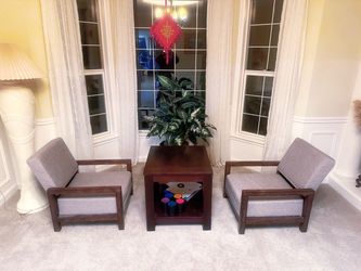 Two sofa chairs and a coffee table.