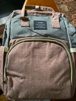 Land travel share diaper bag/changing table