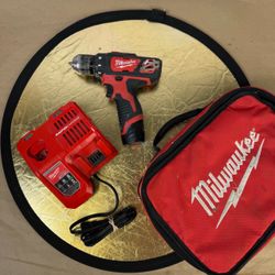 Used Milwaukee 2407-20 Drill/Driver m12 3/8” with charger case and battery