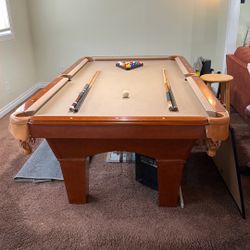 Pool Table 8ft Long in Good Condition and slate bottom has balls and pool sticks 