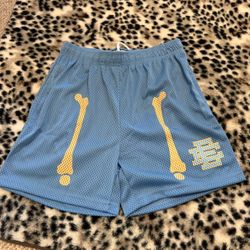 Blue EE shorts with yellow bones, size medium