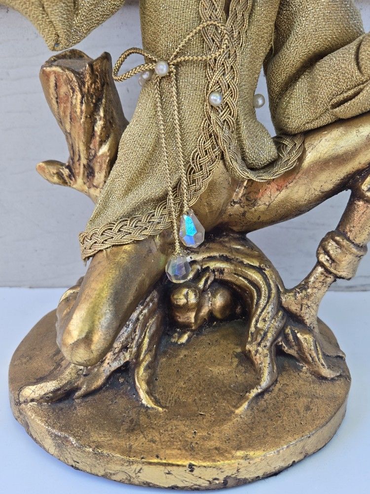 beautifully executed wooden elf playing the violin.