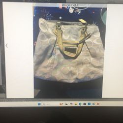 A Used-good Woman’s White Coach Bag
