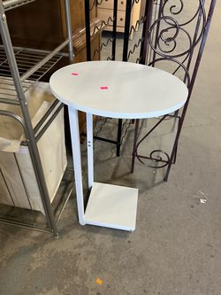 White oval side table (in store)