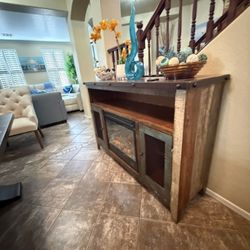 Beautiful rustic fireplace /tv stand in excellent condion with two mesh doors multicolor finish