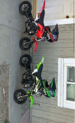 Two 2 strokes with helmets