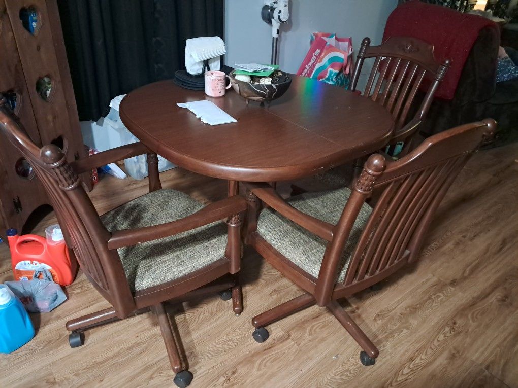 Kitchen Table And 3 Rolling Chairs