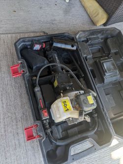 Like new gas powered fence post driver has the whole kit