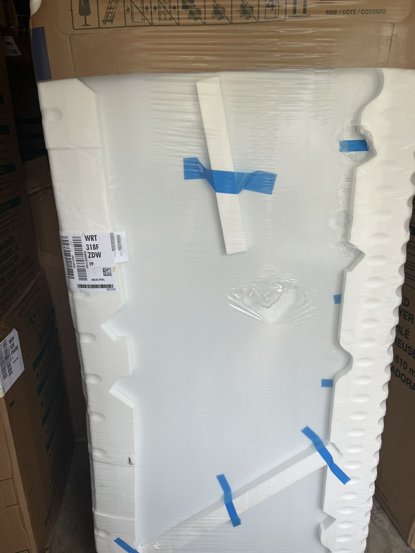 Large Whirlpool Refrigerator White. Also Large Whirlpool Stackable Washer Dry